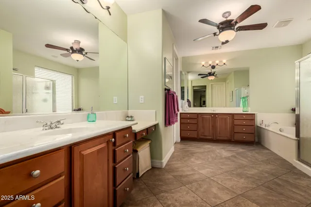 a kitchen with stainless steel appliances granite countertop a sink a stove microwave and cabinets