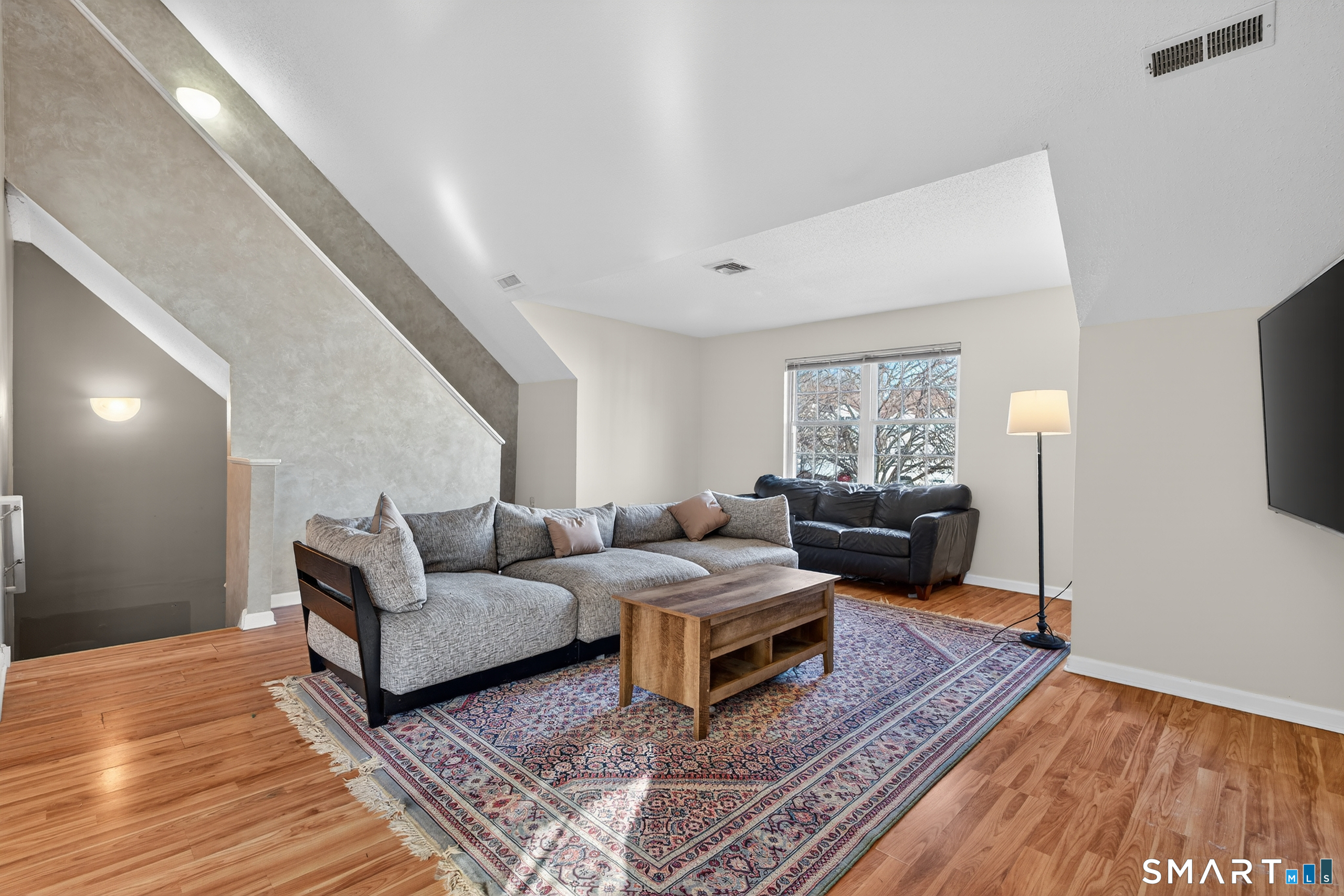 2390 State Street, Unit L17C Hamden, CT 06517 - Photo 3 of 23 a living room with furniture and a rug