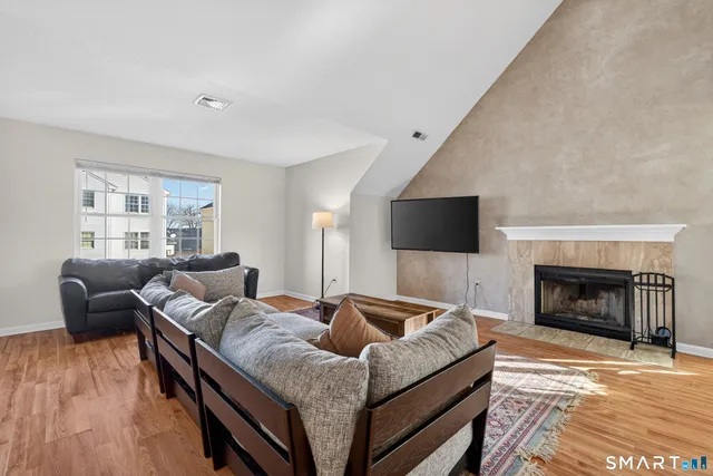 a living room with furniture and a fireplace