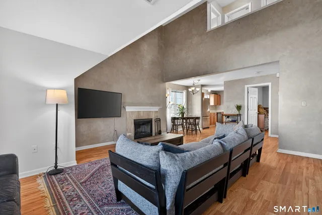 a living room with furniture and a fireplace