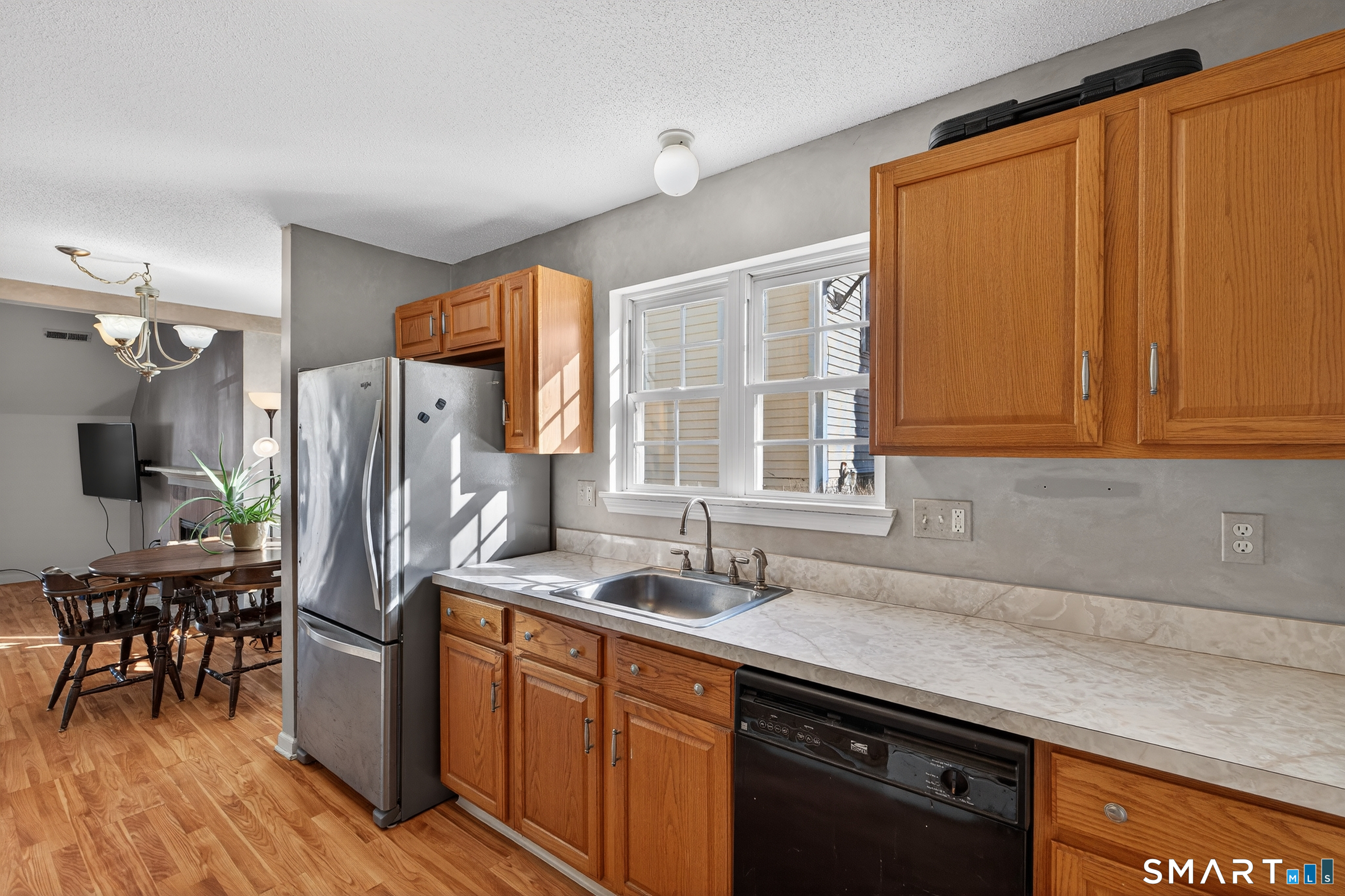 2390 State Street, Unit L17C Hamden, CT 06517 - Photo 9 of 23 a kitchen with stainless steel appliances granite countertop a refrigerator and a sink