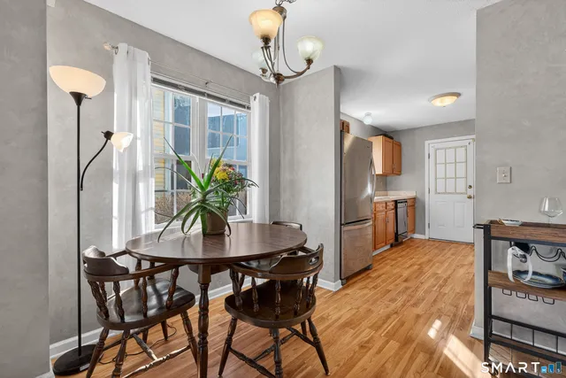a dining room with furniture and window