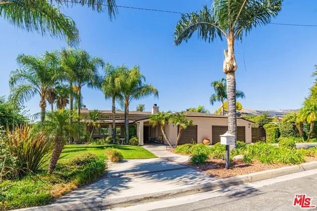 a view of a house with a swimming pool