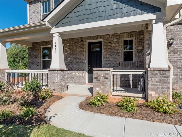 1434 Cilantro Court, Unit 285 Tega Cay, SC 29708 - Photo 2 of 24 a front view of a house with garden