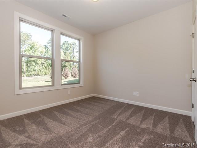 1434 Cilantro Court, Unit 285 Tega Cay, SC 29708 - Photo 12 of 24 an empty room with a window