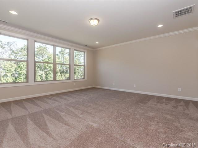 1434 Cilantro Court, Unit 285 Tega Cay, SC 29708 - Photo 14 of 24 an empty room with windows
