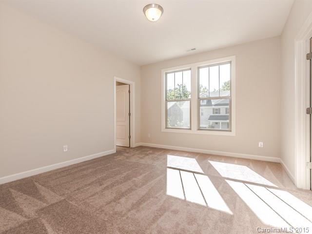 1434 Cilantro Court, Unit 285 Tega Cay, SC 29708 - Photo 18 of 24 an empty room with windows