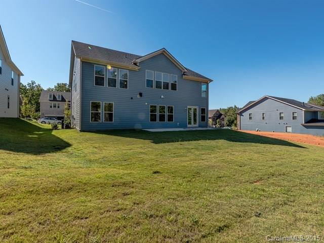 1434 Cilantro Court, Unit 285 Tega Cay, SC 29708 - Photo 21 of 24 a front view of a house with a yard