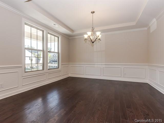 1434 Cilantro Court, Unit 285 Tega Cay, SC 29708 - Photo 4 of 24 a view of empty room with wooden floor and fan