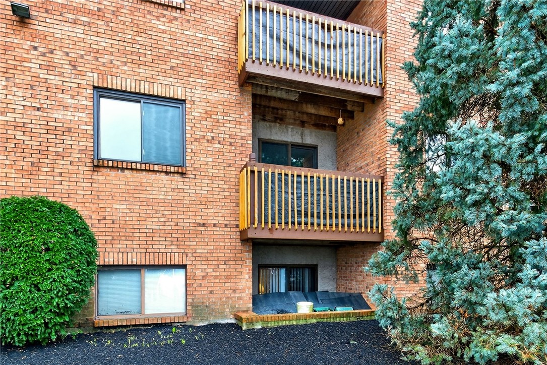 3151 Roesch Boulevard, Unit 6 Fairfield, OH 45014 - Photo 27 of 29 Brick facade building featuring individual balconies, enhancing outdoor living spaces for residents.
