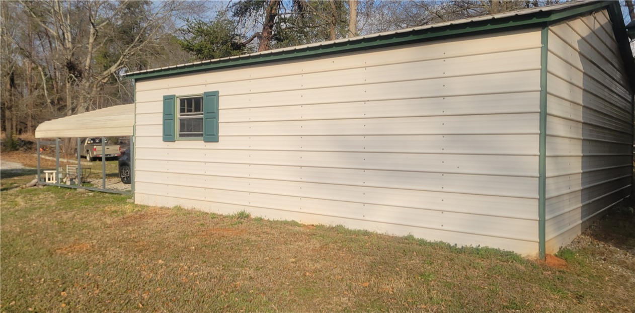 517 Dalton Road Piedmont, SC 29673 - Photo 11 of 12 This outdoor building offers practical storage with a convenient attached carport.