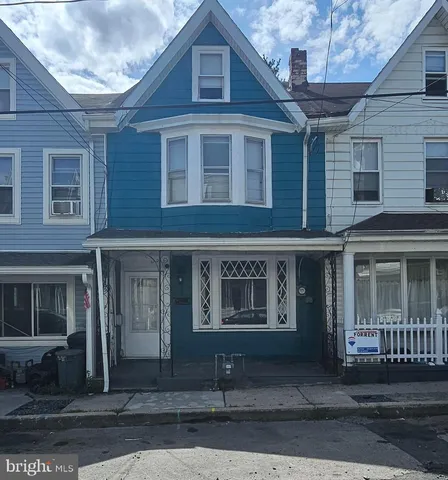 a front view of a house with a garage