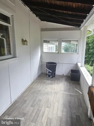 a view of a livingroom with furniture and windows