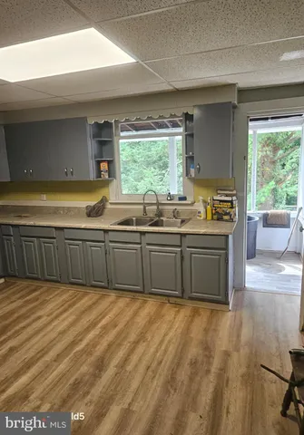 a kitchen with a sink and a stove