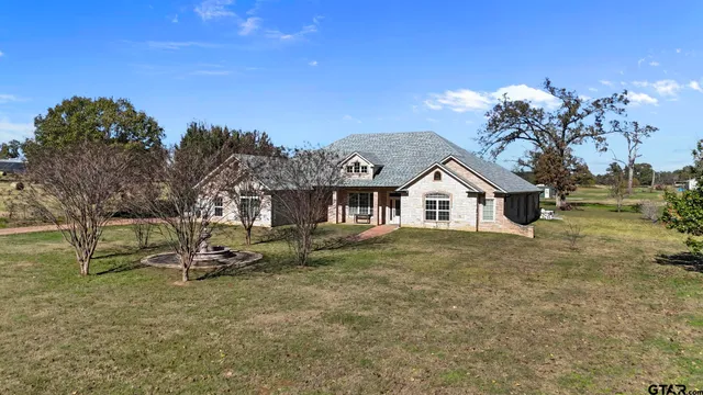 a kitchen with a stove a sink and a refrigerator