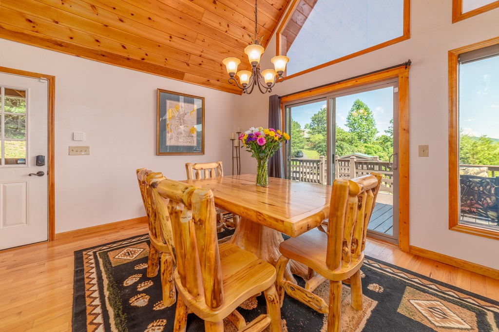 730 Dillon Oaks Drive Murphy, NC 28906 - Photo 17 of 38 a view of a dining room with furniture wooden floor and chandelier