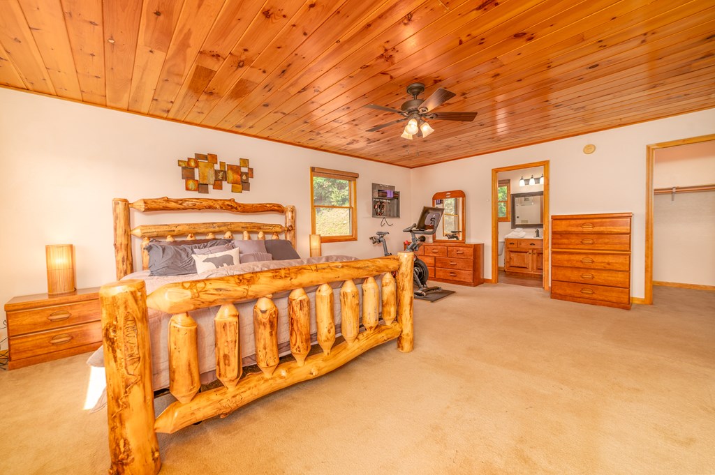 730 Dillon Oaks Drive Murphy, NC 28906 - Photo 20 of 38 a spacious bedroom with a bed and a walk in closet