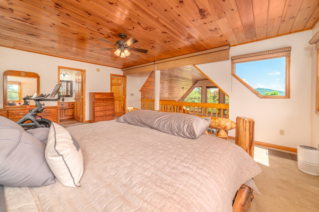 730 Dillon Oaks Drive Murphy, NC 28906 - Photo 22 of 38 a bedroom with a bed a table and window