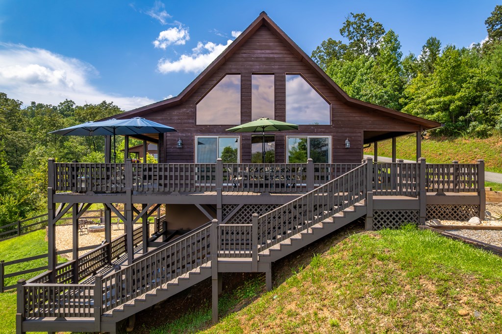 730 Dillon Oaks Drive Murphy, NC 28906 - Photo 5 of 38 a front view of house along with deck and outdoor seating