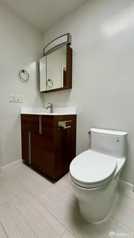a bathroom with a toilet and a sink