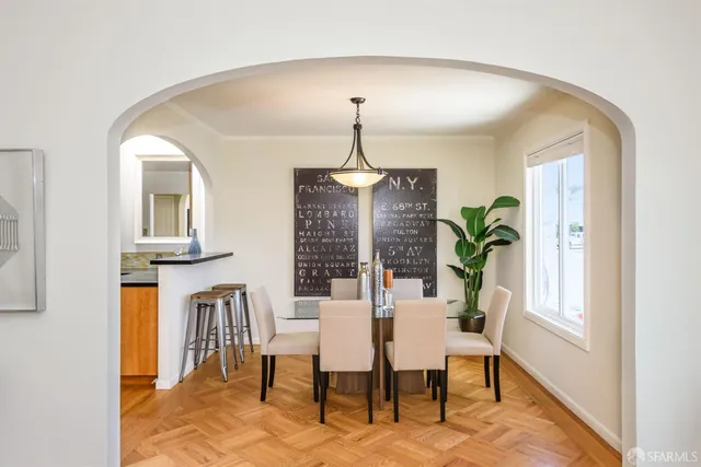 a view of a dining room with furniture and window