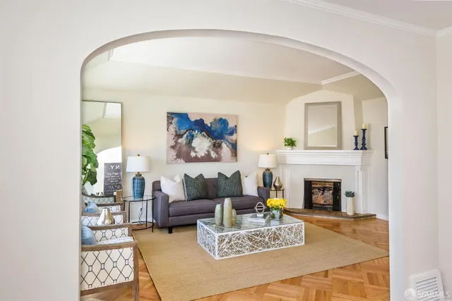 a living room with furniture and a fireplace
