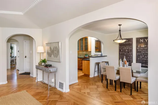 a view of a living room and dining room