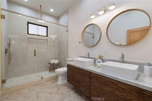 a living room with furniture a large window and a dining table