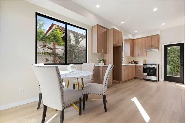 a kitchen with stainless steel appliances granite countertop a refrigerator sink and cabinets