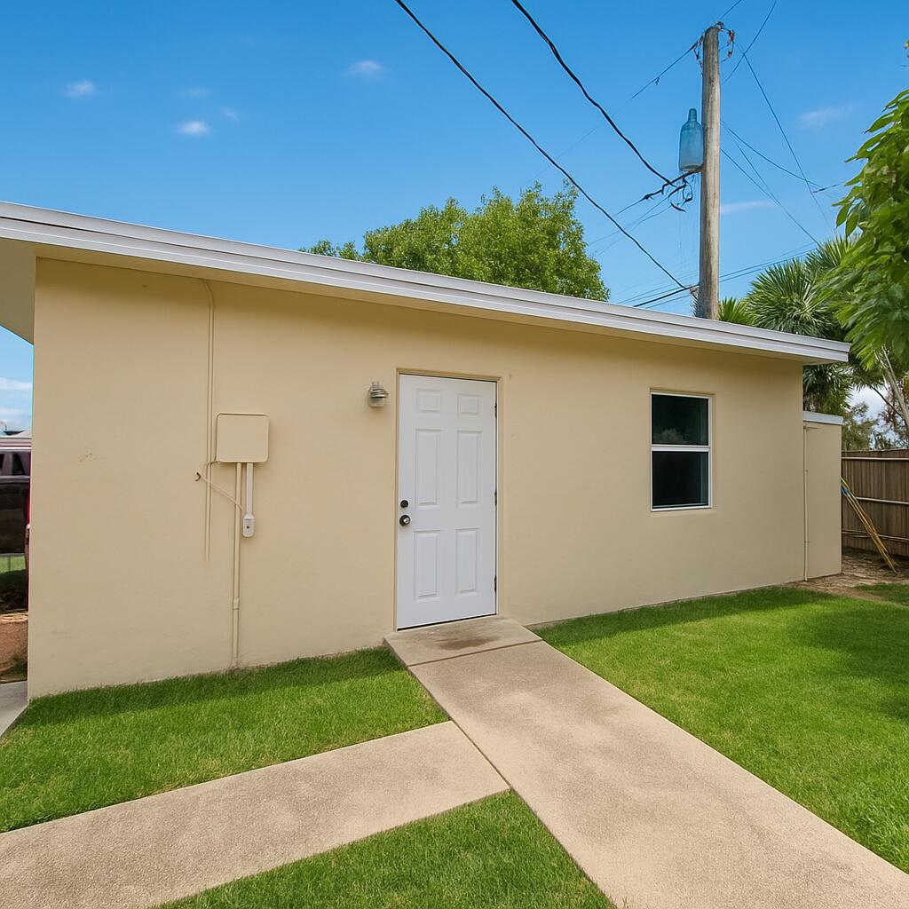 a view of a backyard with potted plants