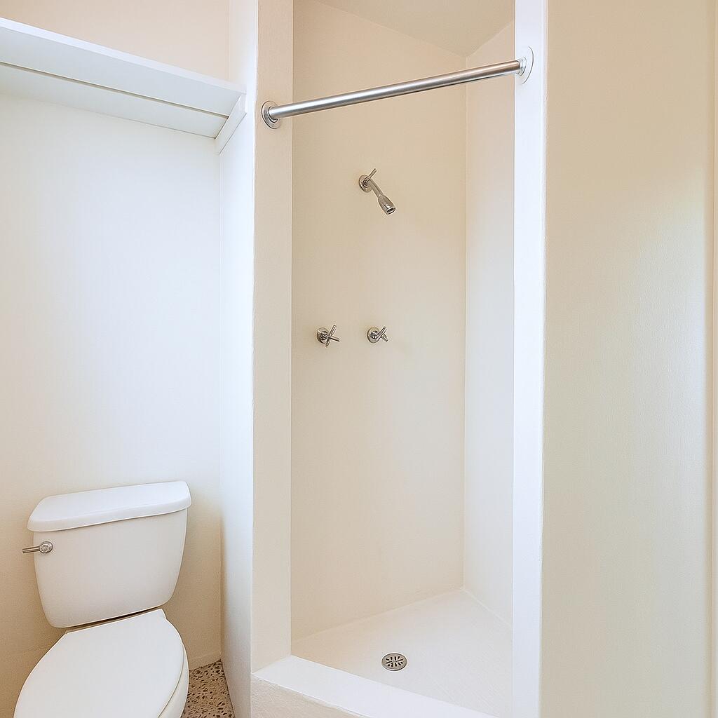 528 58th Street, Unit 1/2 West Palm Beach, FL 33407 - Photo 8 of 8 a bathroom with a shower and a toilet
