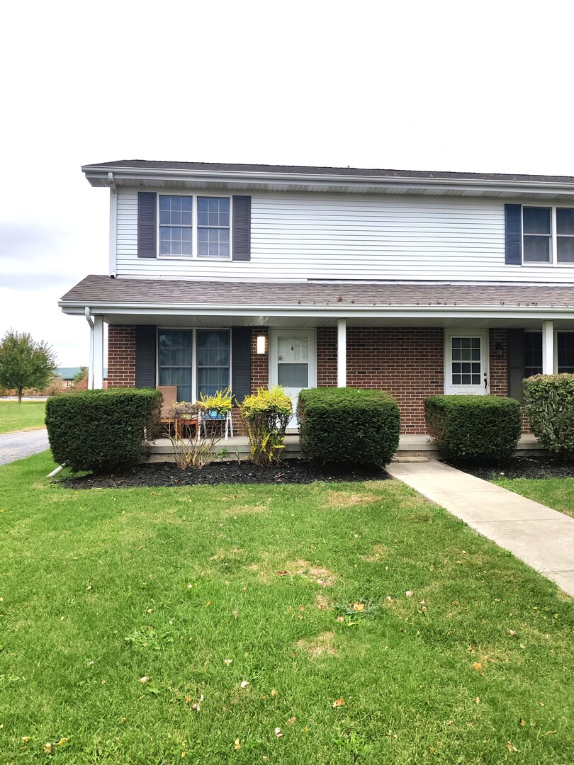 117 Colonial Parkway, Unit A Yorkville, IL 60560 - Photo 1 of 12 a view of a house with a yard porch and sitting area