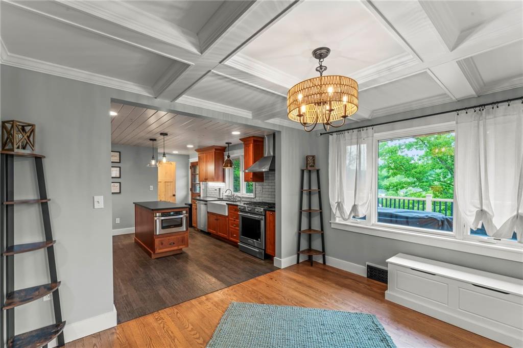 857 East McMurray Road Venetia, PA 15367 - Photo 13 of 37 a living room with fireplace furniture and a chandelier