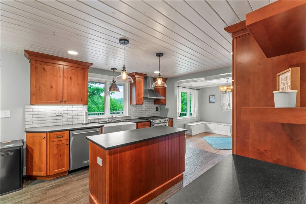 857 East McMurray Road Venetia, PA 15367 - Photo 15 of 37 a kitchen with wooden cabinets and sink