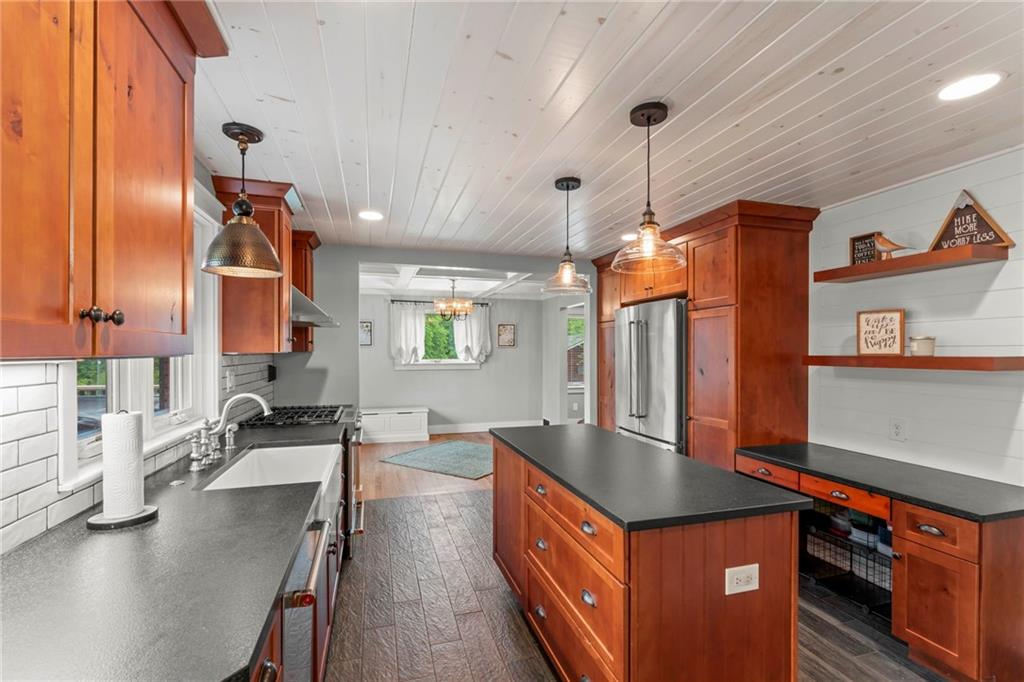 857 East McMurray Road Venetia, PA 15367 - Photo 16 of 37 a kitchen with stainless steel appliances granite countertop a sink a stove and a refrigerator