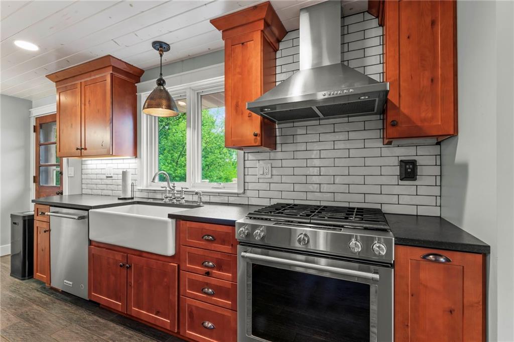 857 East McMurray Road Venetia, PA 15367 - Photo 17 of 37 a kitchen with granite countertop a stove sink and cabinets
