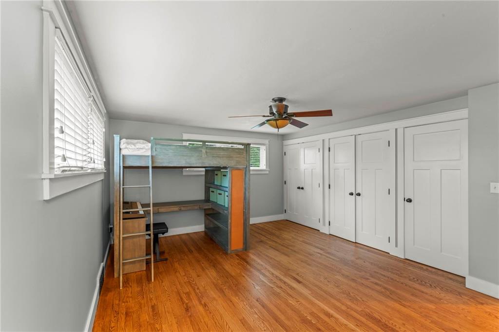 857 East McMurray Road Venetia, PA 15367 - Photo 20 of 37 a bedroom with a bed and a chandelier