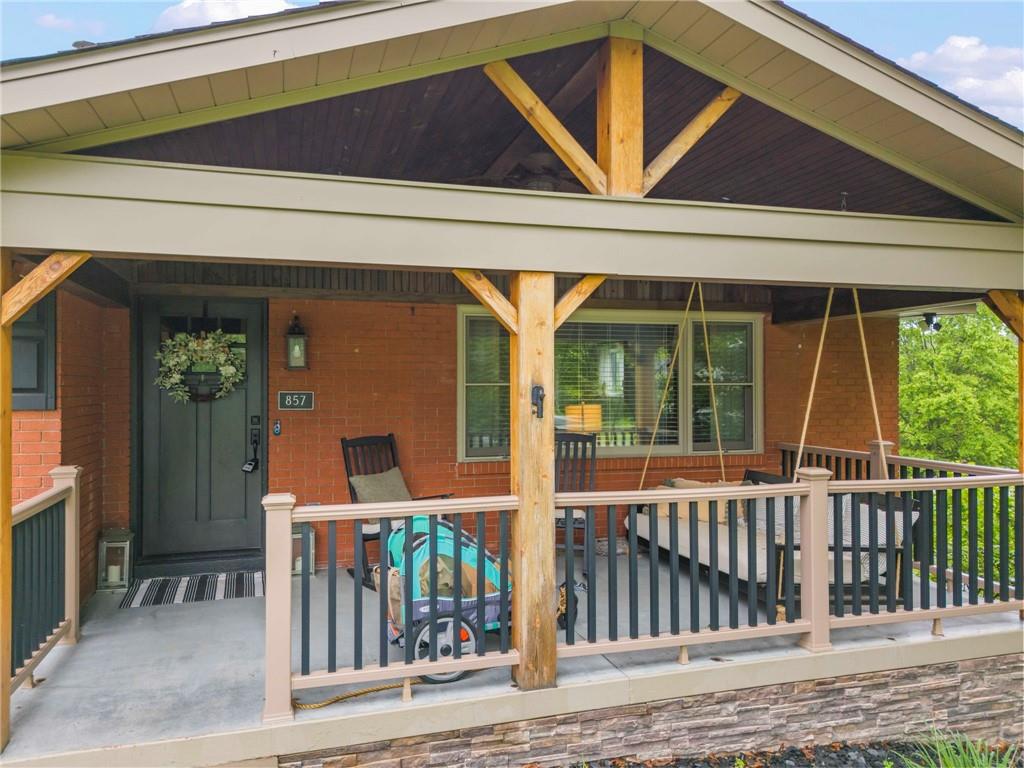 857 East McMurray Road Venetia, PA 15367 - Photo 2 of 37 a front view of a house with porch and furniture