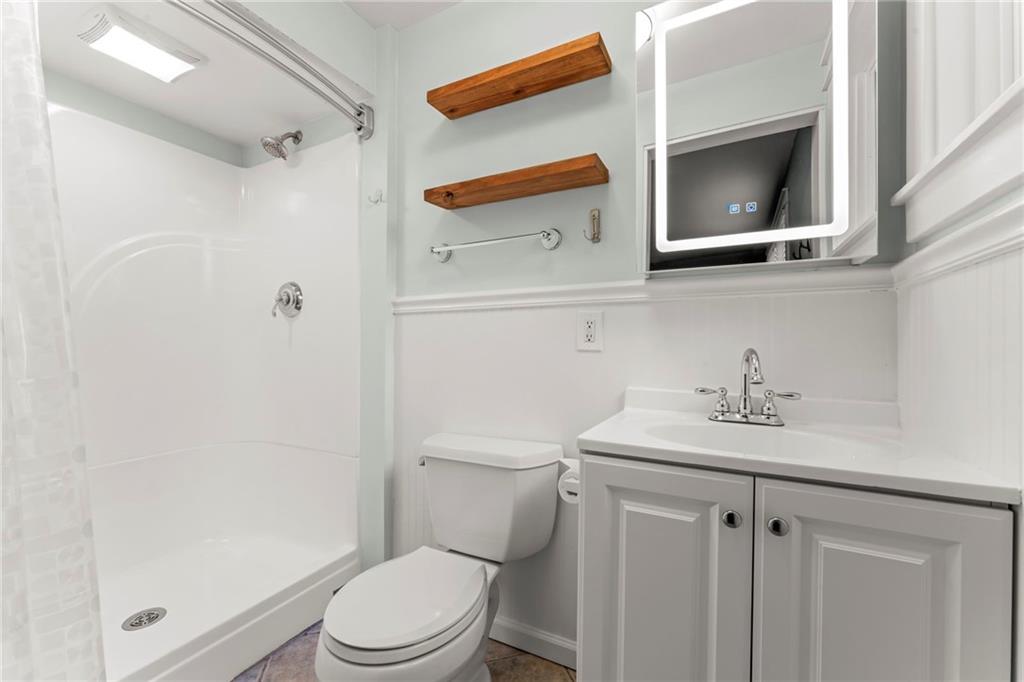 857 East McMurray Road Venetia, PA 15367 - Photo 21 of 37 a bathroom with a sink a toilet and shower