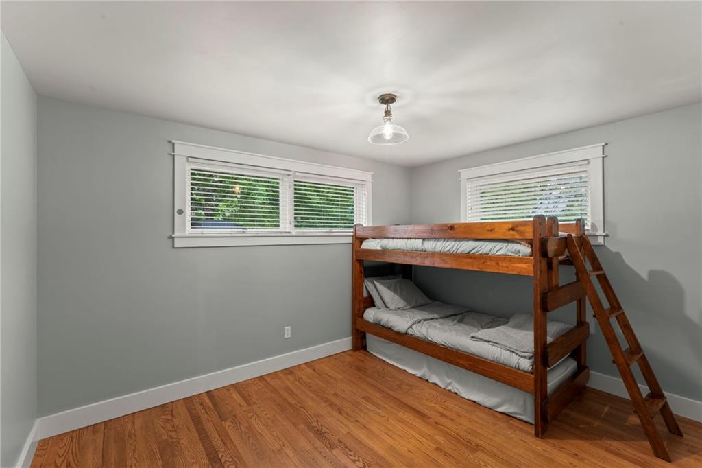 857 East McMurray Road Venetia, PA 15367 - Photo 22 of 37 a bedroom with a bed and wooden floor