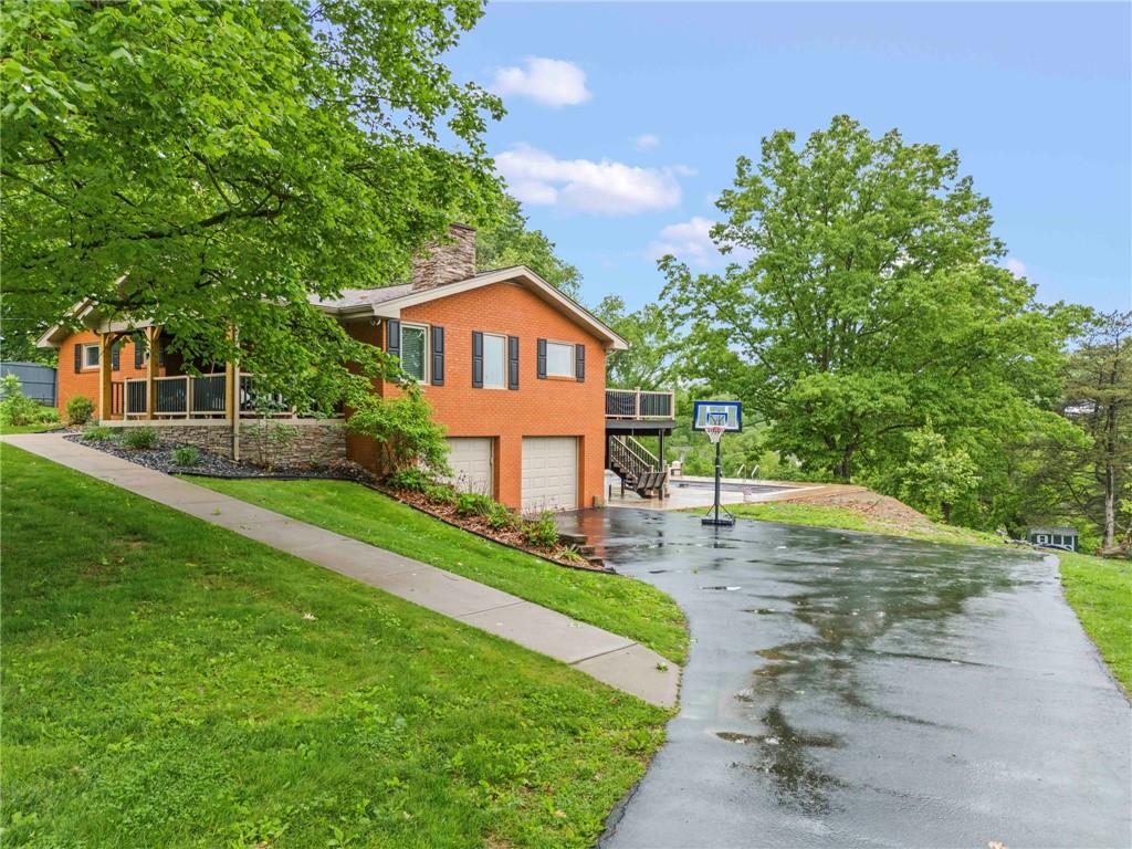 857 East McMurray Road Venetia, PA 15367 - Photo 3 of 37 a front view of a house with a yard