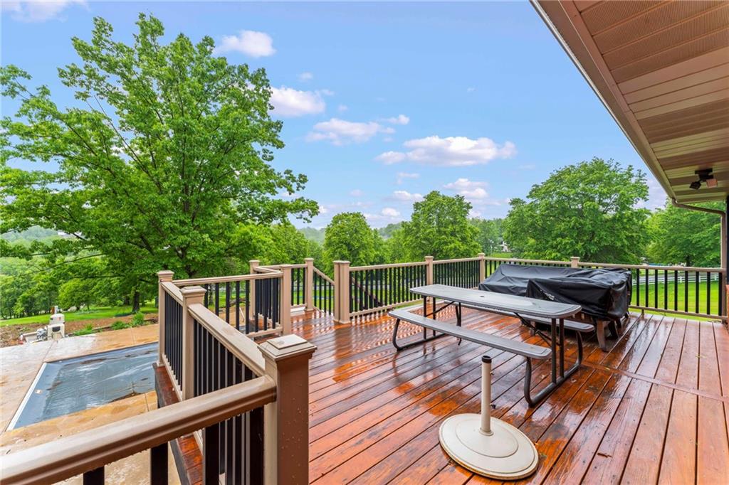857 East McMurray Road Venetia, PA 15367 - Photo 33 of 37 a balcony with wooden floor and outdoor seating