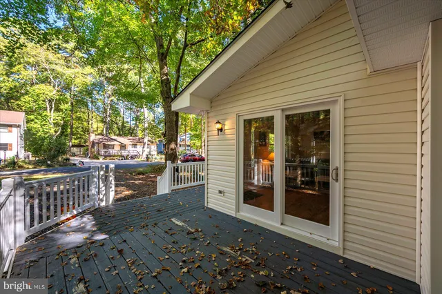 an aerial view of a house with outdoor space and sitting area