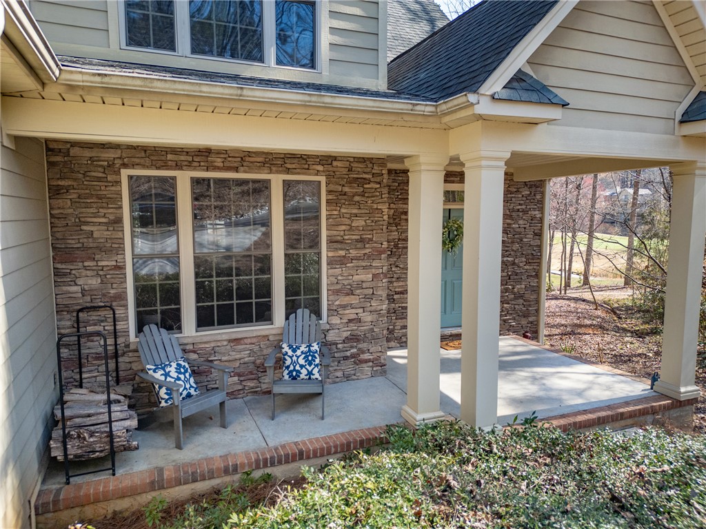 7 Divots Landing Salem, SC 29676 - Photo 3 of 47 This inviting home showcases a charming covered porch and durable stone accents.