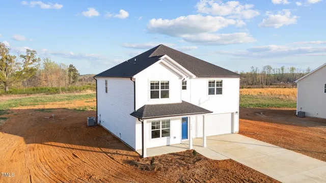 a kitchen with sink a microwave and cabinets