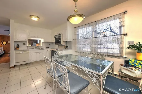 a kitchen with a sink cabinets and window