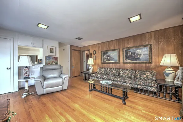 a living room with furniture and a table