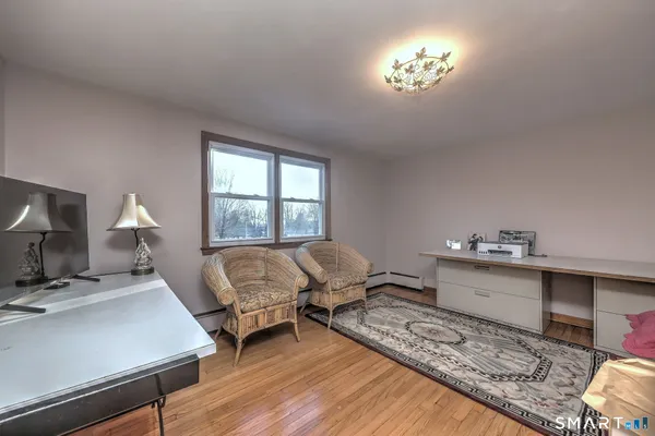 a living room with furniture and a window