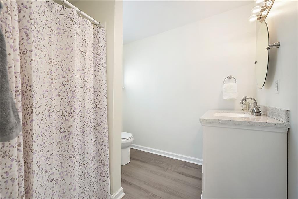 2012 Mohawk Road Pittsburgh, PA 15241 - Photo 13 of 25 a bathroom with a sink a toilet and a mirror