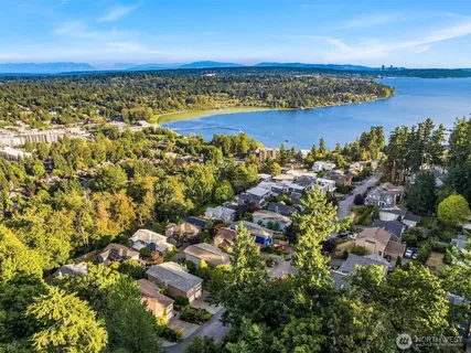 an aerial view of a houses with a lake view